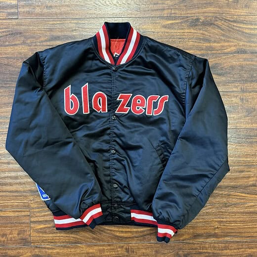 Front view of vintage Portland Trail Blazers Starter jacket with "blazers" embroidered in red and white on the chest.